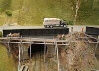 Loaded truck on unfinished bridge