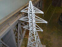 Tower and wires too close to bridge